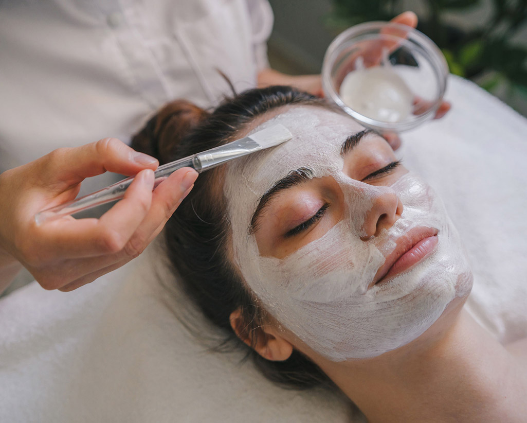 Applying cream on face
